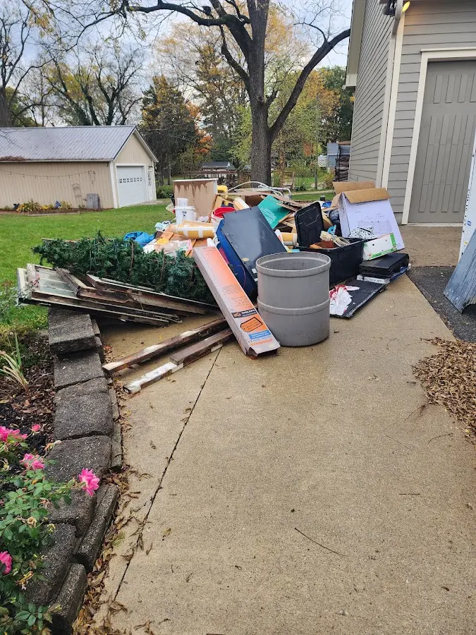 Dumpster being loaded with debris for Commercial Dumpster Rental in Colorado City